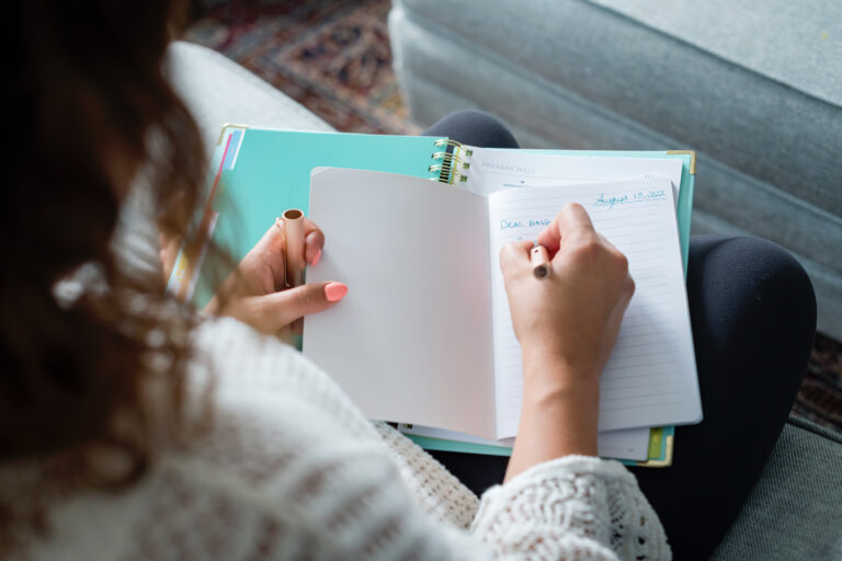 Woman writing in a notebook