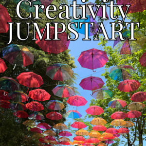 Colorful umbrellas suspended overhead in an outdoor walkway lined with green trees under a bright blue sky, with text overlay reading “30-Day Creativity Jumpstart” and “30-Day Challenge.