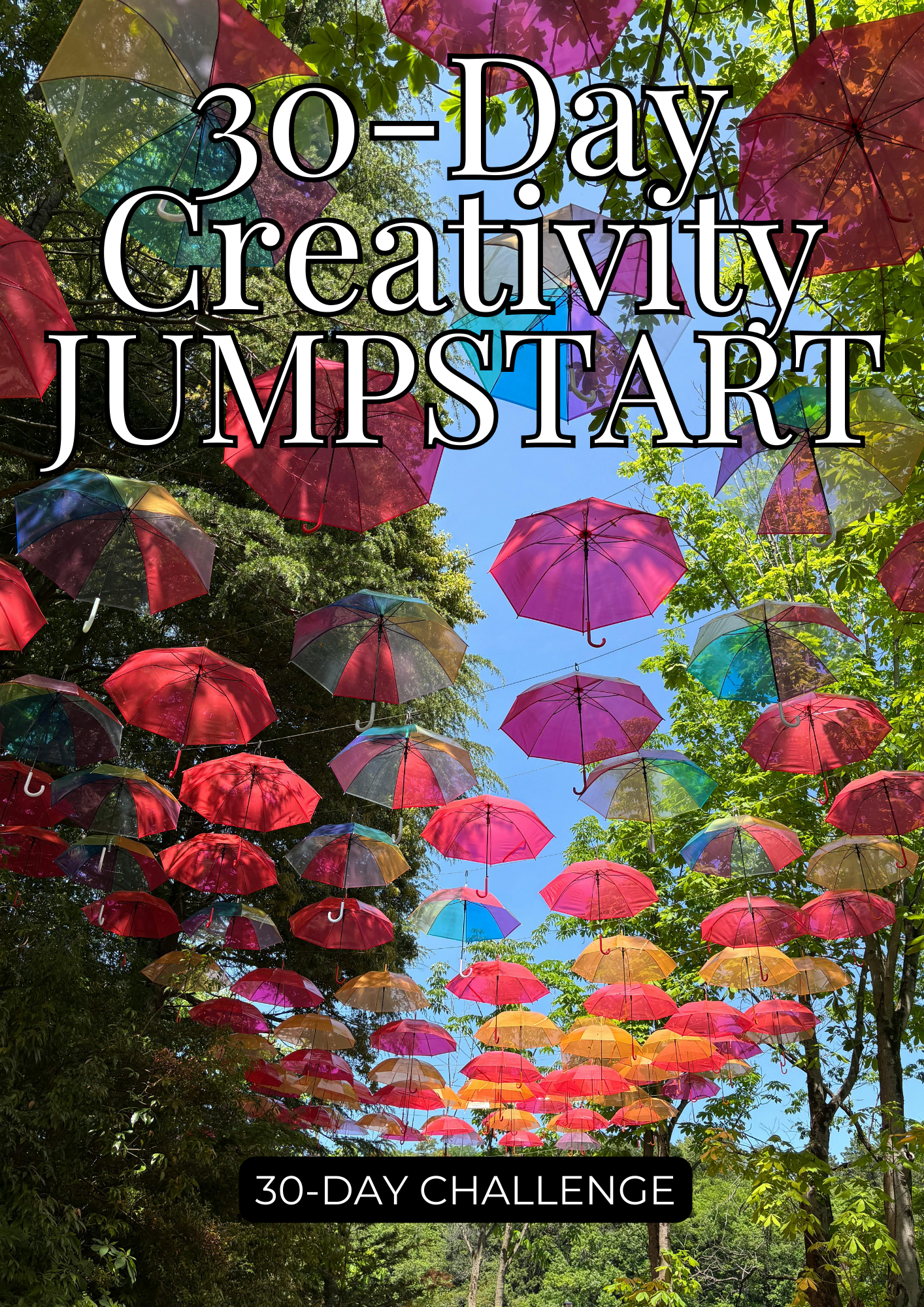 Colorful umbrellas suspended overhead in an outdoor walkway lined with green trees under a bright blue sky, with text overlay reading “30-Day Creativity Jumpstart” and “30-Day Challenge.