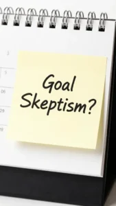Closeup desk calendar with goal skeptism question note