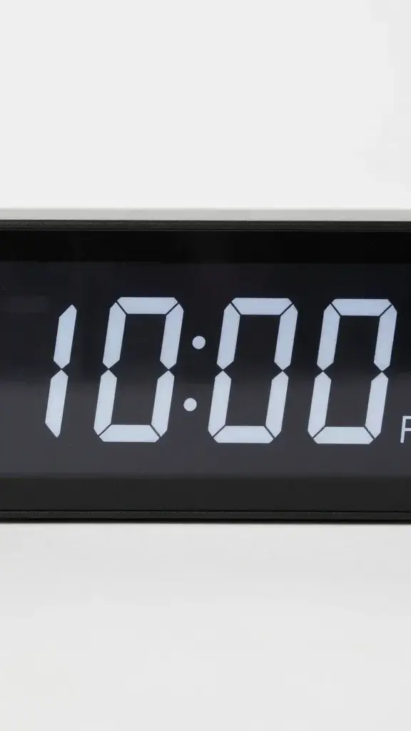 Closeup of a digital alarm clock showing 10:00 PM
