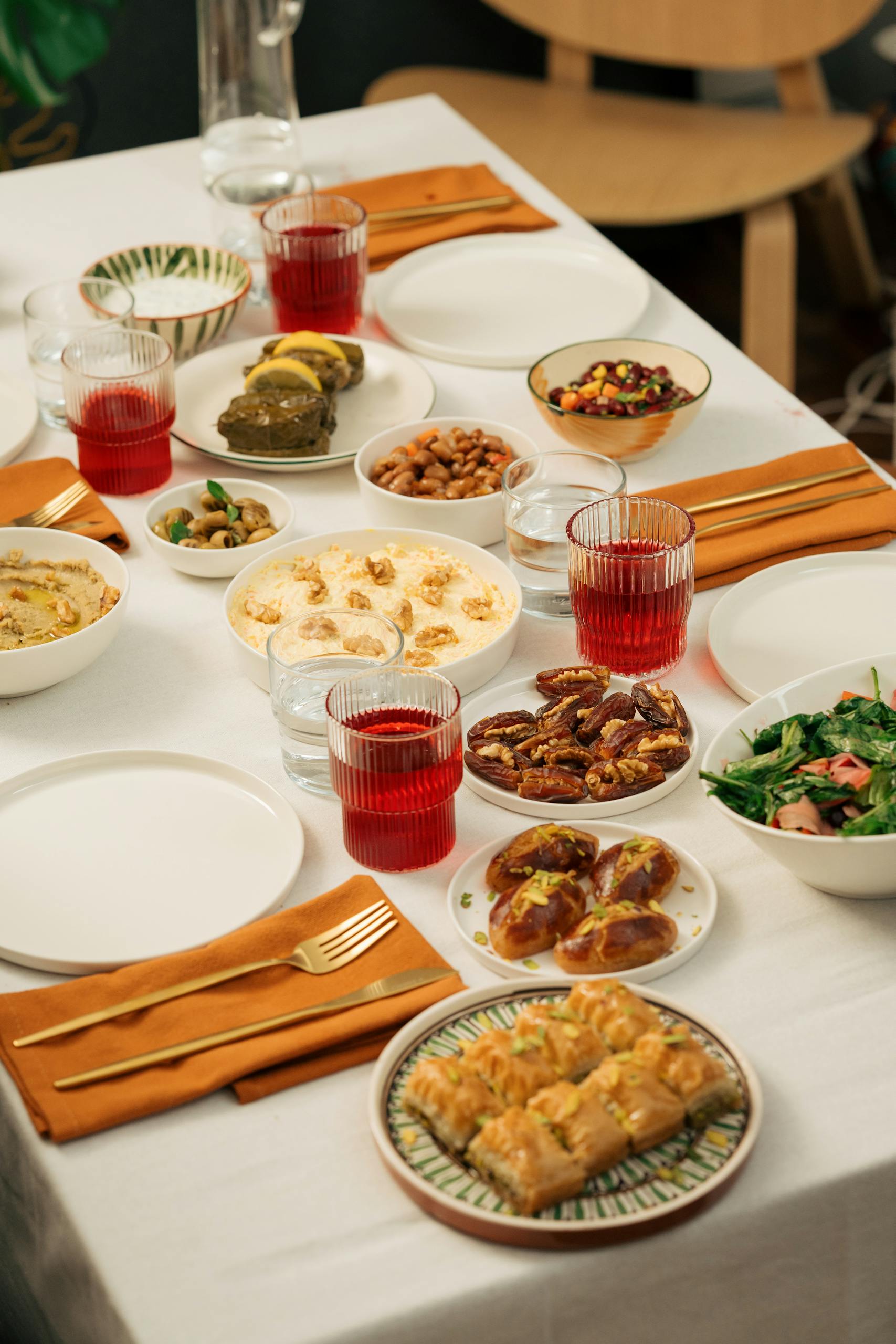 A beautifully arranged Turkish feast featuring various traditional dishes on a dining table.