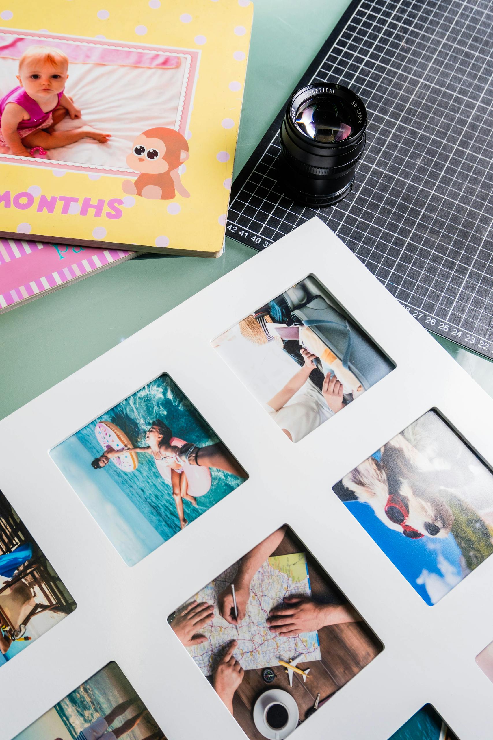 A collection of vacation photos and baby memories in a picture frame.