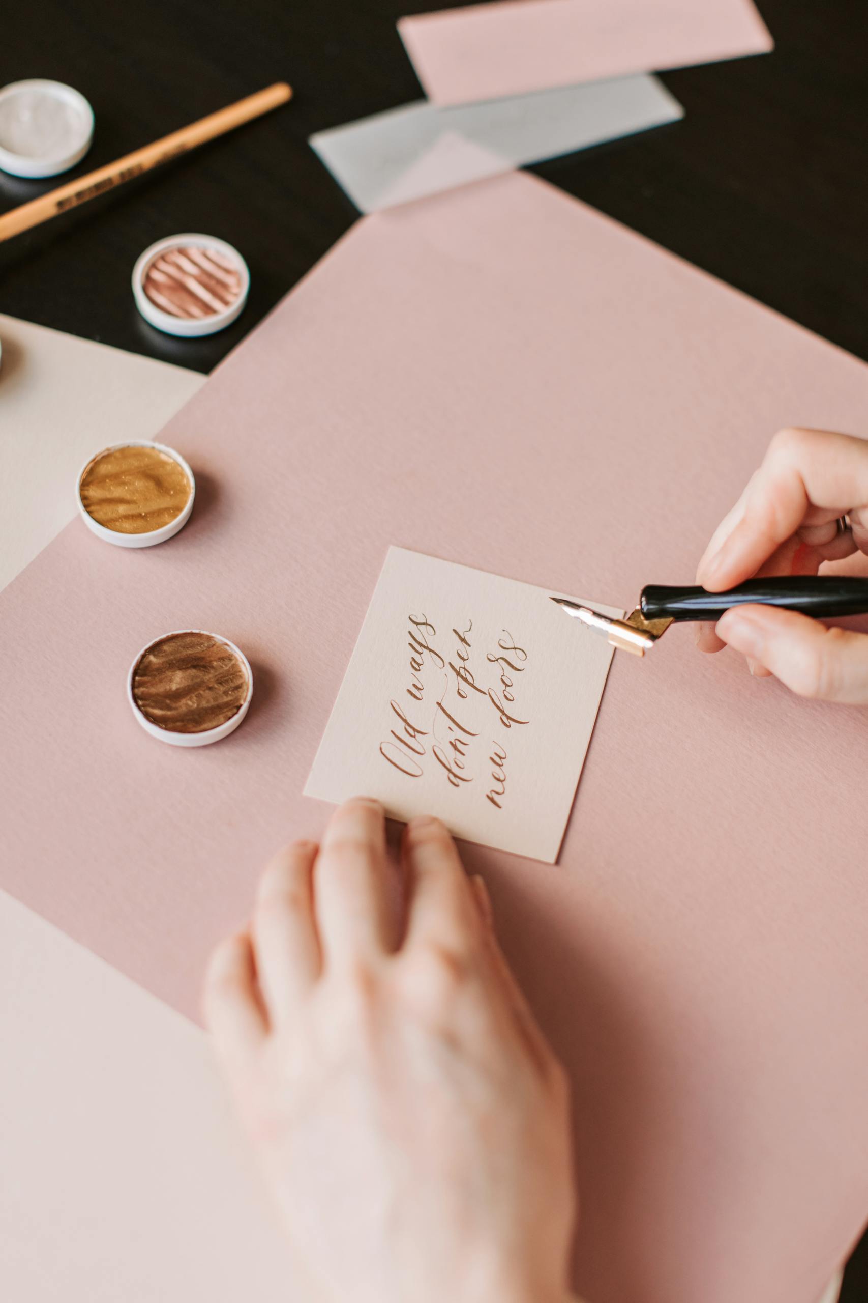 Elegant calligraphy on paper with ink and pen, displaying fine handwriting skills.