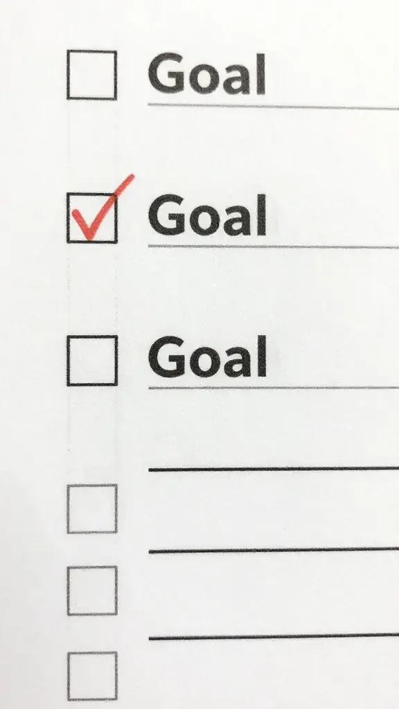 Closeup of a single checklist paper with bold goal items, minimal vignette lighting