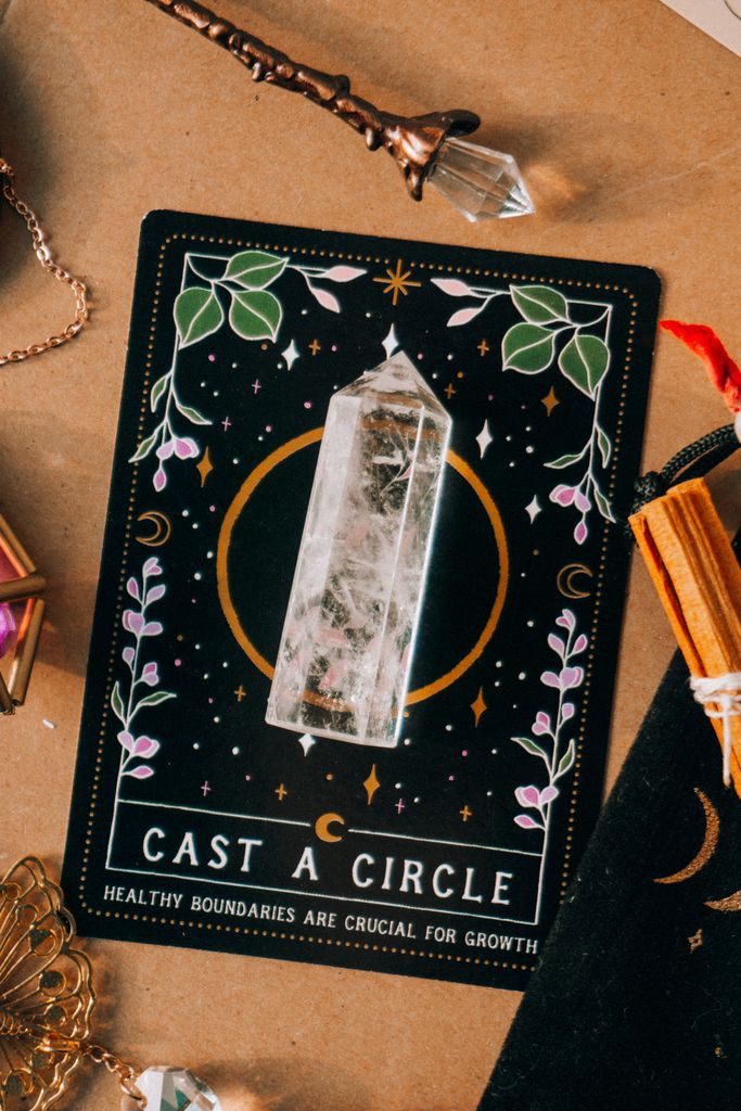 A tarot card laying flat with a crystal and various mystical objects around it, casting an enchanting vibe.