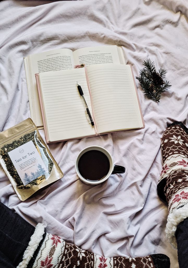 A warm scene with tea, books, and cozy socks on a winter morning.