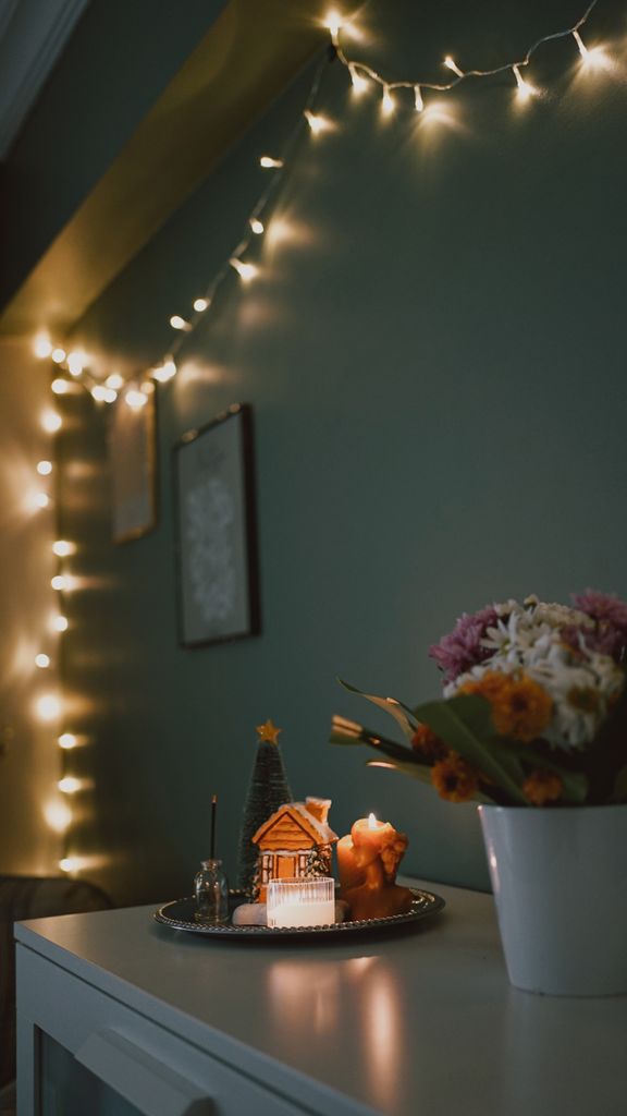 Warm and cozy indoor Christmas decor with fairy lights and gingerbread house.